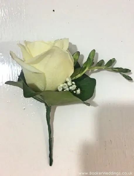 white rose and purple freesia best man buttonhole