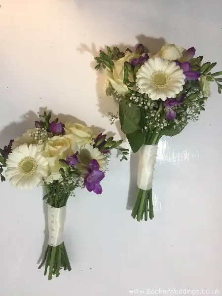 white roses white gerbera and purple freesia bridesmaids handtied bouquets