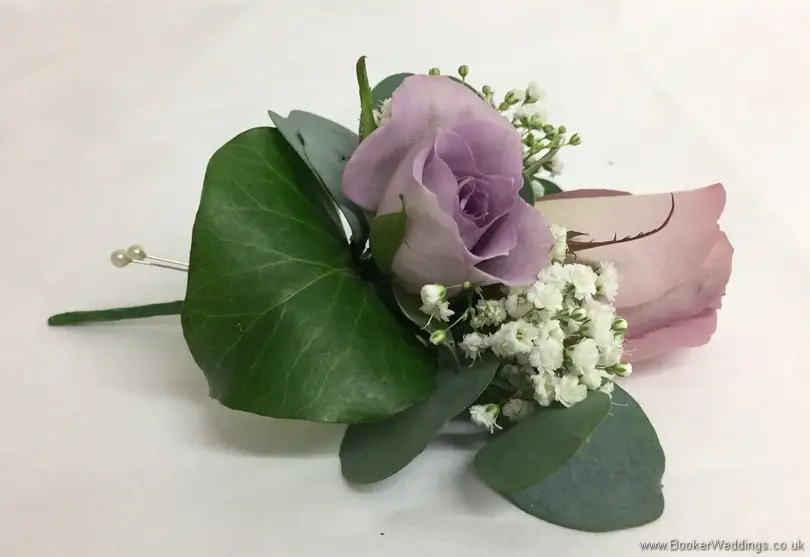 Grooms buttonhole in lilac and cream with roses and gypsy grass_side view