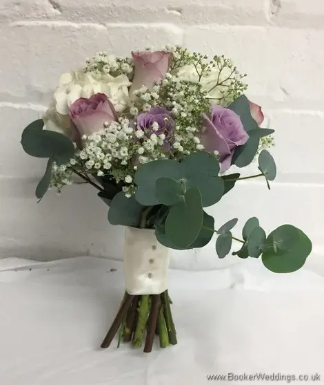 Handtied Bridesmaid bouquet in cream and mauve including hydranges, roses and gypsy grass_side view