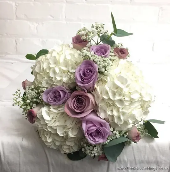 Handtied Bridesmaid bouquet in cream and mauve including hydranges, roses and gypsy grass_top