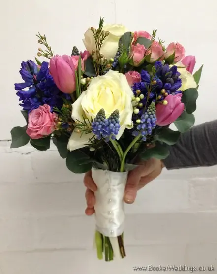 Semi Wild Brides Hand Tied Bouquet of Pale Pink, Blue and Cream with Cream Roses, Pink Spray Roses, Pin kTulips, Wax Flowers, Blue Muscari and Hyacinth Side View