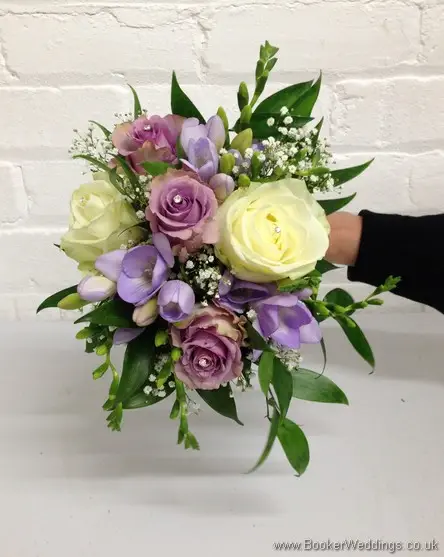 Lilac and Cream Roses with Lilac Lissianthus, Lilac Freesia and Gypsophila Hand Tied Bridesmaid Bouquet