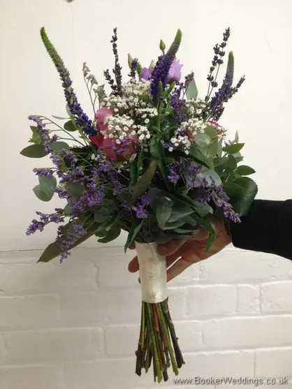 Just Picked Country Flowers in purples and lilacs with grey foliage with roses, lissianthus, veronica, gypsy grass and eucalyptus Bridesmaid Bouquet Side View