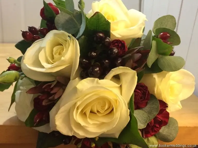 white rose red spray carnations hypericum berries eucadendron and foliages bridesmaid bouquet
