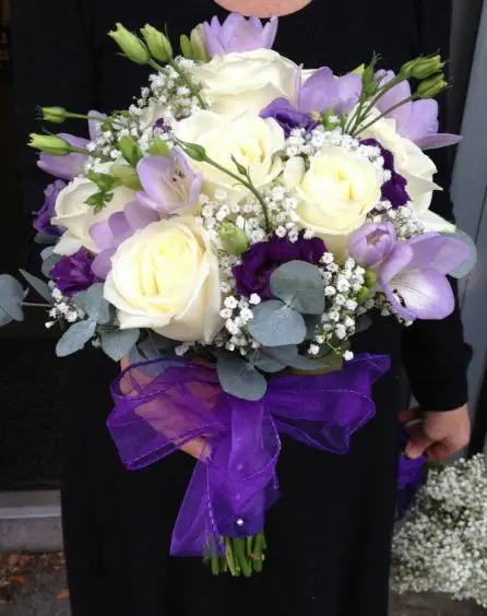 Cream and Purple Rose Freesia and Lissanthus Brides Bouquet - Side