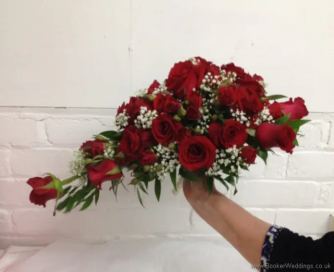 Red and White Bridal Hand Tied Teardrop shower bouquet in Red roses spray rose and gypsy grass Side View