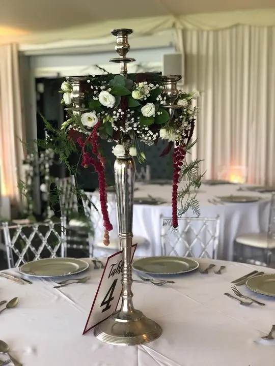 White and Burgundy Candleabra at Wedding Venue
