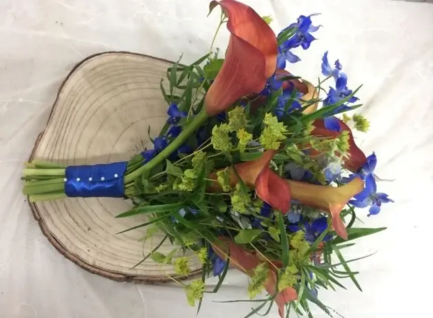 Bride Hand Tied In Orange And Blue With Ribbon Handle