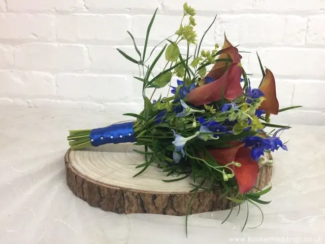 Bridesmaids Bouquet In Orange And Blue With Blue Ribbon Handle