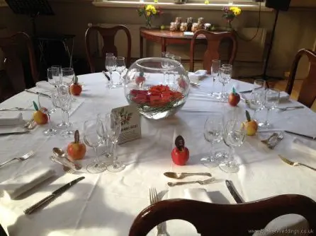 Bright and Vibrant Orange and Red Gerbera Fishbowl Table Arrangement at the Racquet Club Liverpool
