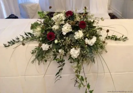 Wild Country Garden Winter Wedding Top Table Arrangement2  Bartle Hall Preston