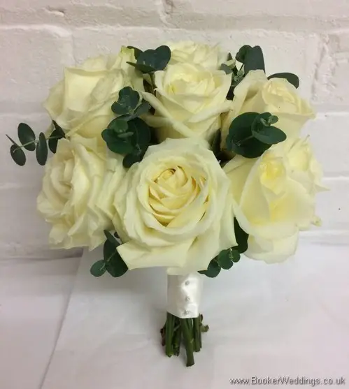 Hand tied Bridal Bouquet with ivory roses and greenery_tilted