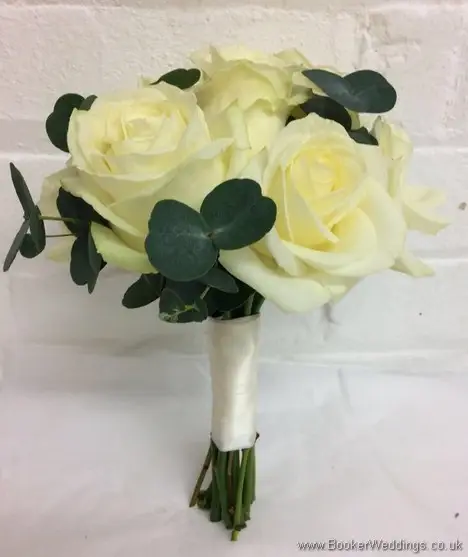 Hand tied bridesmaid bouquet with ivory roses and greenery_side