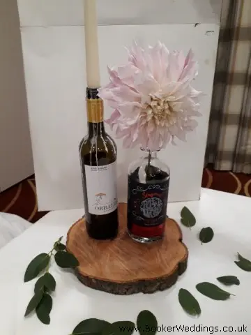 Table Centrepiece of Gin Bottles and Dahlias