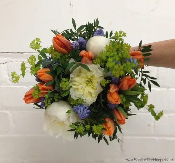 Bridal Bouquet in a Spring Wedding Flower theme in creams, blues and oranges with muscari, tulips, peonies and bupleurum