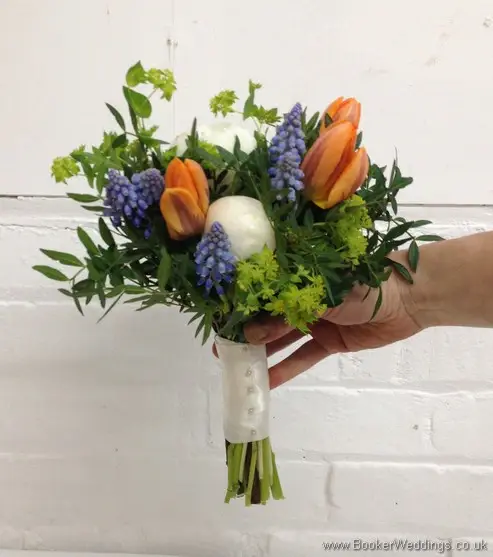 Bridesmaid Bouquet in a Spring Wedding Flower theme in creams, blues and oranges with muscari, tulips, peonies and bupleurum Side View
